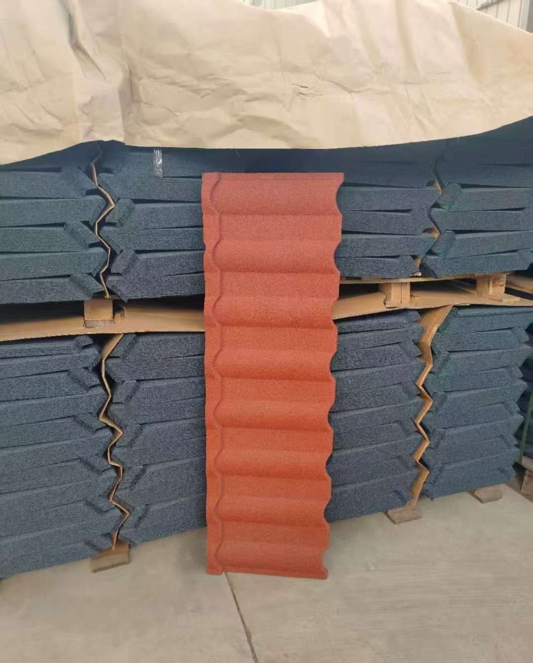 Aerial shot showcasing industrial building roofs with varying colors in Luoyang, China.